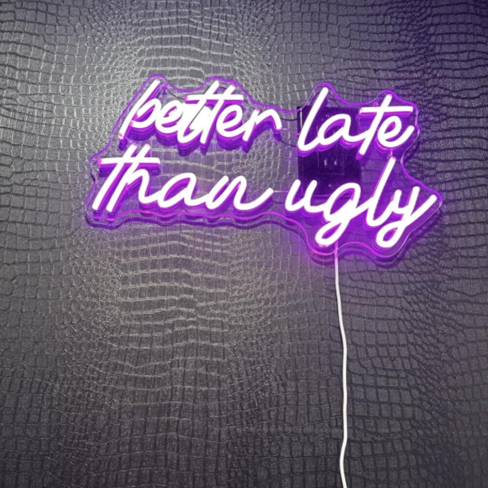 "Better Late Than Ugly" neon pink sign